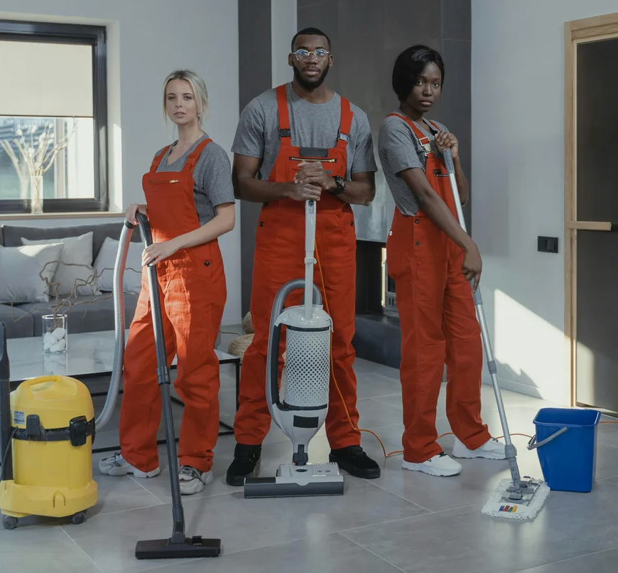 Professional cleaner smiling while managing bookings on a laptop
